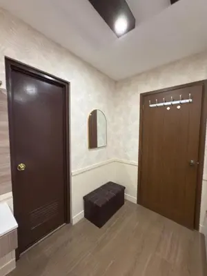 a room with a door and a stool in front of it at Mi Casa en Manila in Manila
