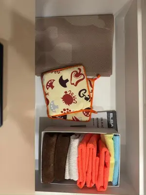 an open refrigerator with towels and a bag in it at Mi Casa en Manila in Manila