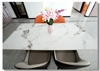 a white marble table with a vase of flowers on it at Golden Seagulls Hotel in Manila