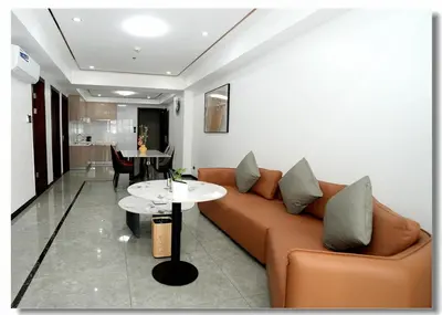 a living room with a couch and a table at Golden Seagulls Hotel in Manila