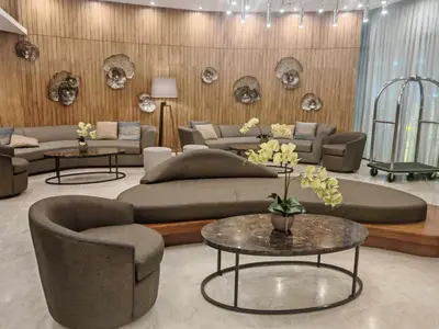 a living room with couches and tables and skulls at Zeki's Place - Shore 2 Residences MOA in Manila
