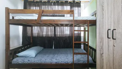 a couple of bunk beds in a room at Lascianos SMDC Shore Residences by RedDoorz in Manila