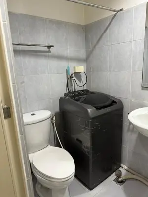 a small bathroom with a toilet and a sink at Eriel condotel in Manila