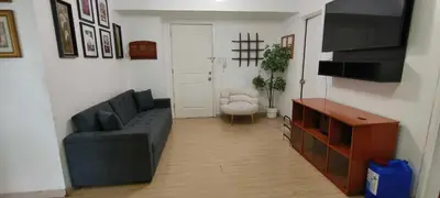 a living room with a couch and a chair at Elite Homestays Family-Friendly Condo Near Malls with Pool & Gym in Manila