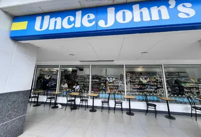 a store with tables and chairs in front of a store at Oasis MOA- Sea Residences in Manila