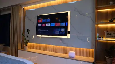 a flat screen tv on a wall in a room at Air Residence Makati Suite Sophisticated Living Condo 300 Mbps in Manila
