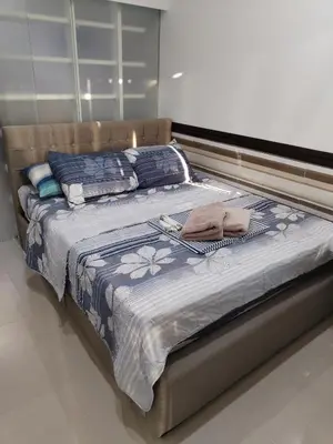 a large bed in a room with at YAM's WANDERLUST in Manila