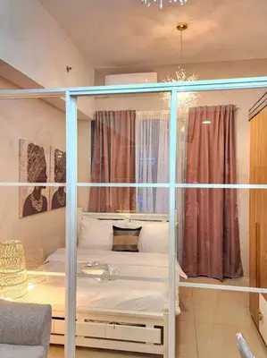 a bedroom with a bunk bed in a room at Payapa Staycation by DC in Manila