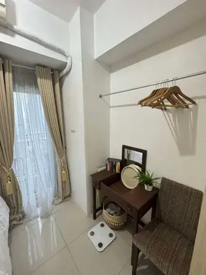 a room with a desk and a chair and a window at Makati Jazz Staycation in Manila