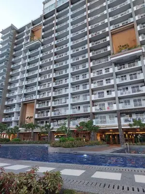 a large apartment building with a pool in front of it at Helaena's Scandi Haven in Manila