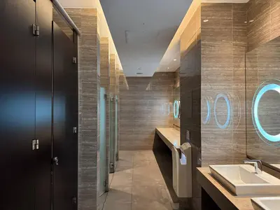 a bathroom with two sinks and a mirror at Studio in Makati - Fast WiFi, Big Balcony, Pool and Gym Access in Manila