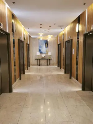 a hallway with a row of elevators in a building at Mall of Asia Pasay Shore 3 residences 2 in Manila