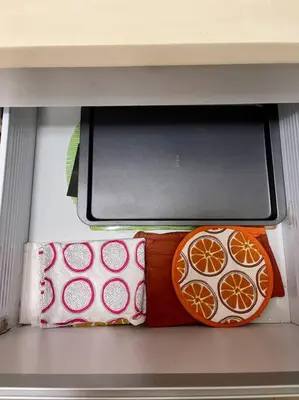 a shelf with three pillows in a drawer at Elegant Family Retreat in the Heart of BGC in Manila