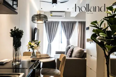 a living room with a couch and a table at Mall of Asia Shore 3 Residences Holland Suites in Manila