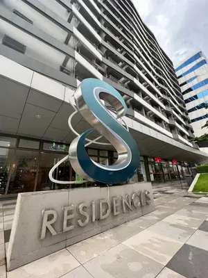 a large sign in front of a building at Comfortable and Cozy 1BR unit near MOA in Manila