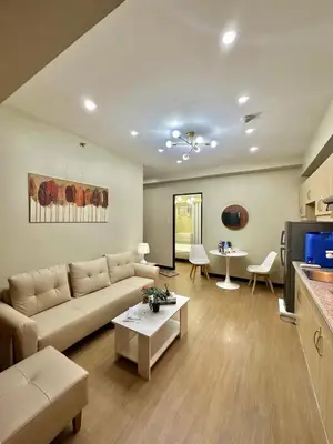a living room with a couch and a table at Fully Furnished One Bedroom Unit with Balcony at Calathea Place, DMCI Homes in Manila