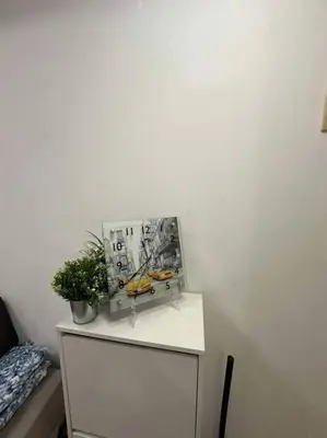 a white cabinet with a plant on top of it at Casita Payapa - newly furnished condo unit 2nd flr in Manila