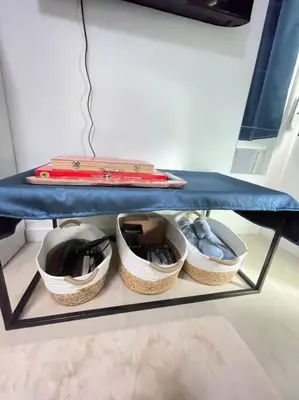 a shelf with three baskets on a blue table at Casita Payapa - newly furnished condo unit 2nd flr in Manila