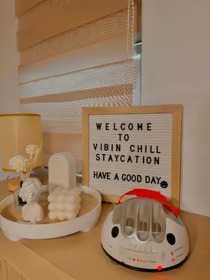 a sign that says welcome to vitamin hill stationhave a good day on a table at Vibin Chill Staycation in Manila