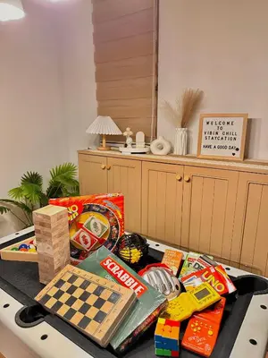 a table with a chess board and chips on it at Vibin Chill Staycation in Manila