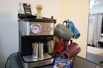 a coffee maker sitting on top of a counter at Sojourner's Suite at 605, City-view condotel near the airport at Monte Carlo Residences Charlene in Manila