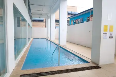 a swimming pool in the middle of a building at Sojourner's Suite at 605, City-view condotel near the airport at Monte Carlo Residences Charlene in Manila