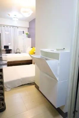 a room with a white desk and a bed at Sojourner's Suite at 605, City-view condotel near the airport at Monte Carlo Residences Charlene in Manila
