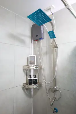 a shower in a bathroom with a blue ceiling at Sojourner's Suite at 605, City-view condotel near the airport at Monte Carlo Residences Charlene in Manila
