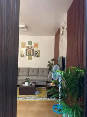 a living room with a couch and a table at Ram's crib at san lorenzo's place condo in Manila