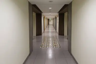 a hallway of a building with a tile floor at Ram's crib at san lorenzo's place condo in Manila