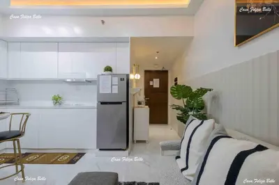 a kitchen with a refrigerator and a counter top at Casa Feliza Belle-veranda overlooking Venice Grand Canal Gondola ride, with pool,gym,tennis,basketball courts,sauna and massage room in Manila