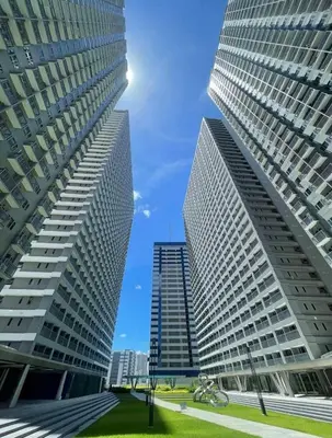 two tall buildings standing next to each other at Gelle Staycation in Manila