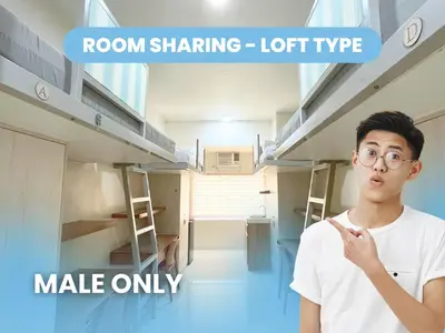 a young man standing in a room in a room sharing loft type make only at UHome Lacson in Manila