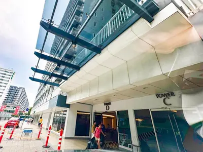 a group of people walking outside of a building at 826 Air Condo Comfort Suite Spacious 1BR in Manila