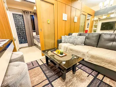 a living room with a couch and a table at 826 Air Condo Comfort Suite Spacious 1BR in Manila