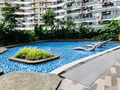 a swimming pool with a slide in the middle of a building at 1 Bedroom Condo in Makati City in Manila