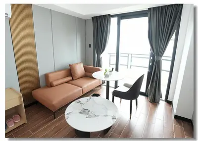 a living room with a couch and a table at Golden Seagulls Hotel in Manila