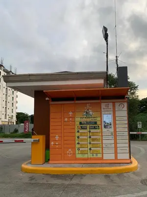 a bus stop with an orange and yellow at Cozy Condominium at Amaia Steps Nuvali in Pitland
