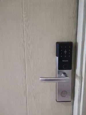 a metal door handle with a remote control on it at The Suite Life - Level 42 at Makati in Manila