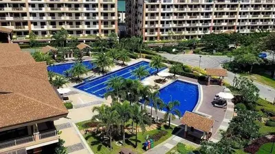 an aerial view of a resort with two pools at 3BR Condo Unit at Mirea Residences in Manila