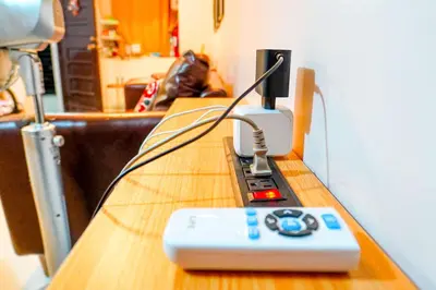 a remote control sitting on top of a table at Calm House near Enchanted Kingdom Sta Rosa with Free Parking, Wifi, Netflix in Santa Rosa