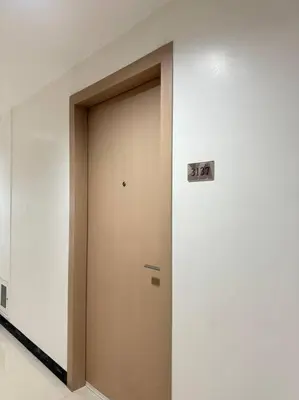 a door in a building with a sign on it at Cozy condo by the MRT & Light Mall experience comfort and convenience in Manila