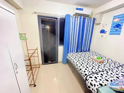 a small room with a bed and a window at SHORE 2 Residences MOA in Manila