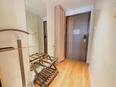 an empty room with a treadmill next to a door at The Hotel at Tower Acqua 1 in Manila