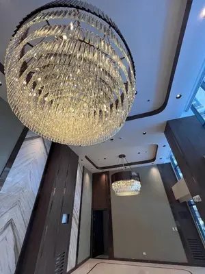 a large chandelier hanging from the ceiling in a room at Gentry Manor Family Suite Balcony City View WiFi Netflix close to Okada 12B in Manila