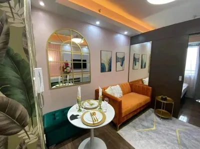 a living room with a couch and a table at 1br at Air Makati Ayala near Makati med in Manila