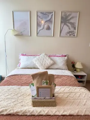 a bedroom with a bed with a basket on it at Cozy 1BR Condo with Uptown Mall View - BGC Zen Suite in Manila