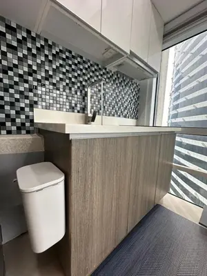 a bathroom with a sink and a toilet in it at Modern Chic 2BR with Panoramic Golf View in BGC in Manila
