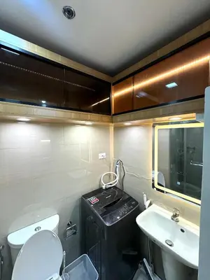 a small bathroom with a toilet and a sink at Katkat Shore 2 Staycation in Manila