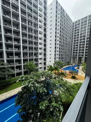 a view from the balcony of a large apartment building at Katkat Shore 2 Staycation in Manila